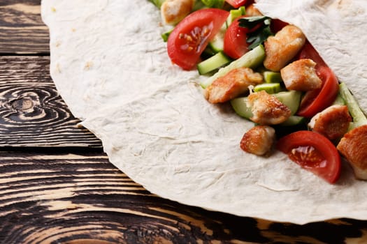Traditional shawarma wrap with chicken and vegetables