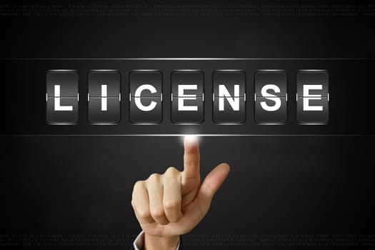 business hand pushing license on Flipboard Display