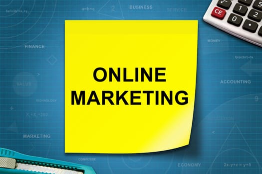 online marketing text on yellow note with graph paper