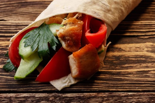 Traditional shawarma wrap with chicken and vegetables