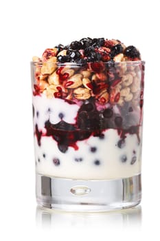 Parfait-style healthy layered snack or dessert with yogurt,bilberry jam,fresh bilberries,puffed honey wheat in glass