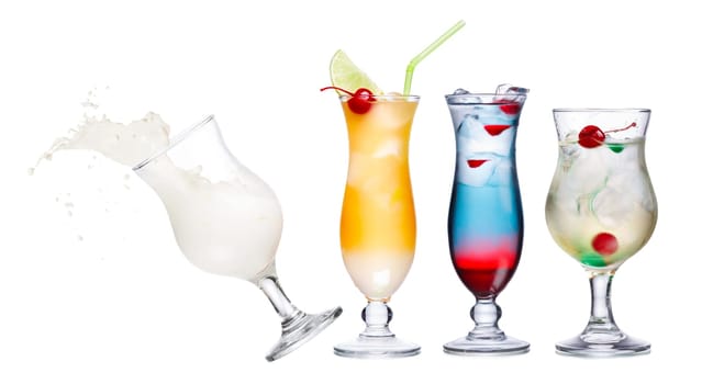 Colourful and spectacular alcoholic cocktails in hurricane glasses