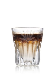 Coffee liqueur alcholic cocktail in faceted shot glass
