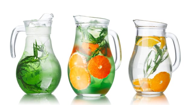 Collection of glass pitchers with tarragon infused detox water