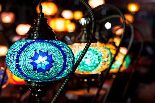 Beautiful colorful mosaic lanterns on street market