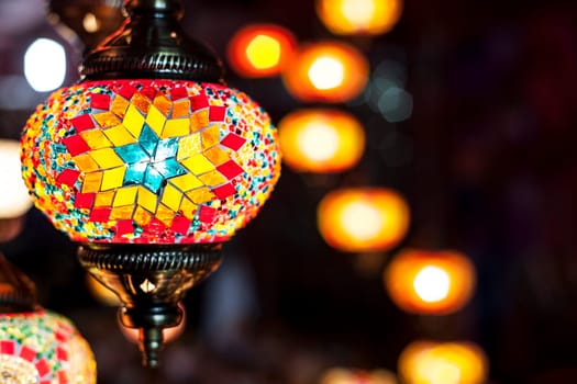 Beautiful colorful mosaic lanterns on street market