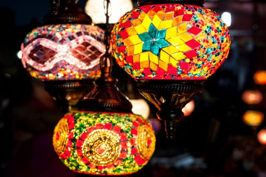 Beautiful colorful mosaic lanterns on street market