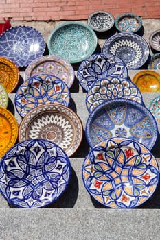 Traditional arabic handcrafted, colorful decorated plates of Morocco