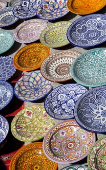 Traditional arabic handcrafted, colorful decorated plates of Morocco