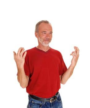 A good looking middle age mal standing waist up isolated for white.background in a red t-shirt..