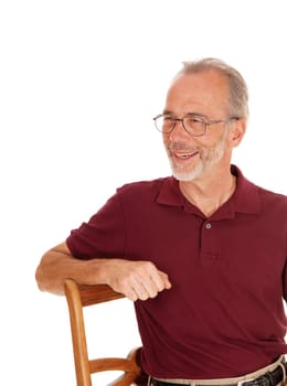 A closeup portrait image of a middle age man, smiling, sitting on a chair,.isolated for white background..