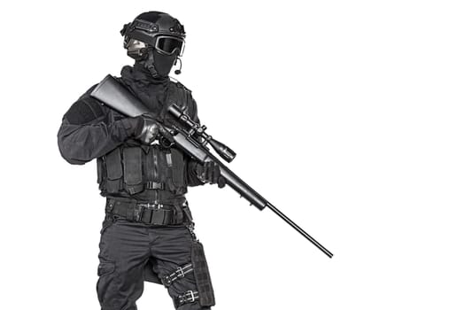 Spec ops police officer SWAT in black uniform and face mask studio shot