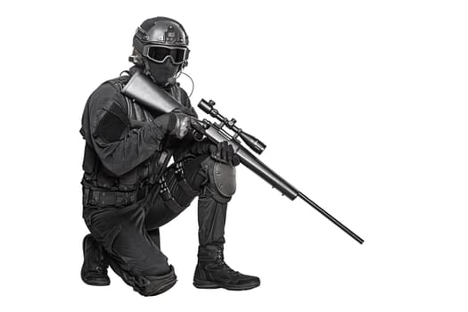 Spec ops police officer SWAT in black uniform and face mask studio shot