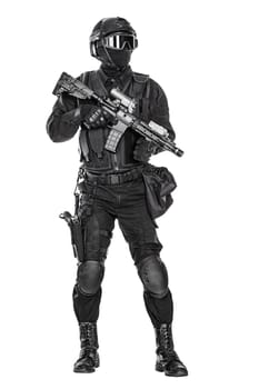 Spec ops police officer SWAT in black uniform and face mask studio shot
