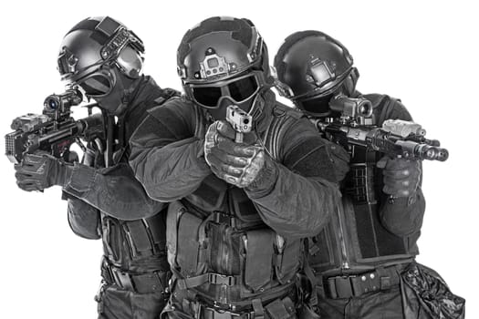 Spec ops police officers SWAT in black uniform and face mask studio shot