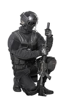 Spec ops police officer SWAT in black uniform and face mask studio shot