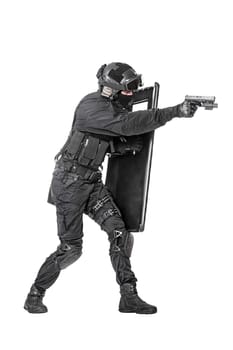 Spec ops police officer SWAT with ballistic shield studio shot