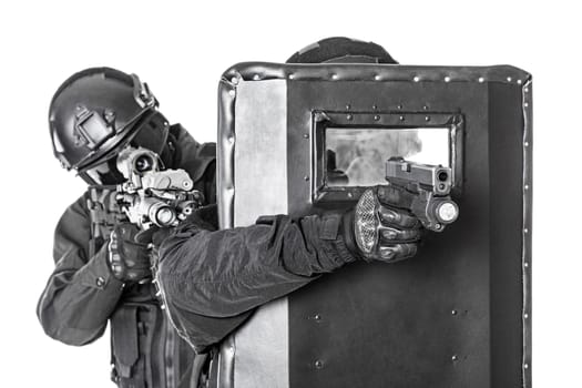 Spec ops police officers SWAT with ballistic shield studio shot