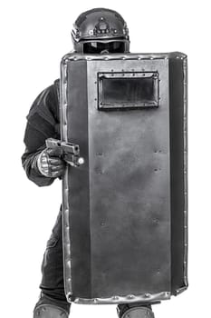 Spec ops police officer SWAT with ballistic shield studio shot