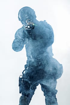police officer SWAT in black uniform and face mask studio shot
