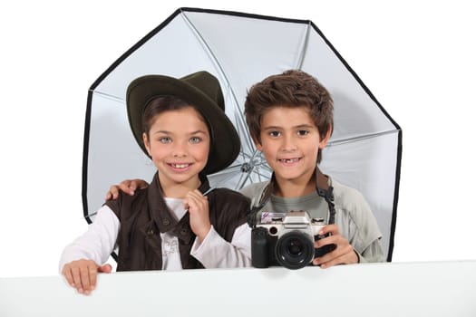 Kids dressed as photographers