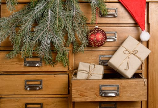 Christmas gifts in the drawer of a cabinet