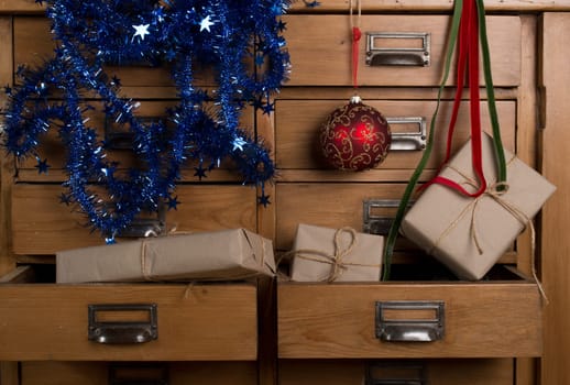 Christmas gifts in the drawer of a cabinet