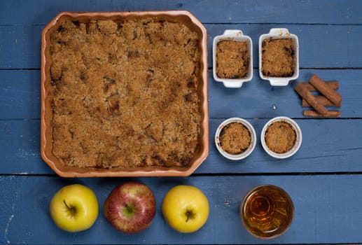 apple crumble on a blue wooden table