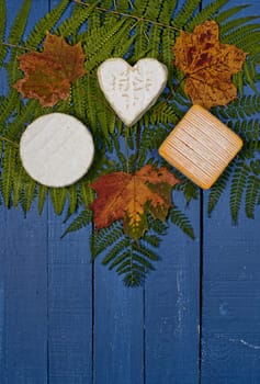 different french cheeses on blue wooden table