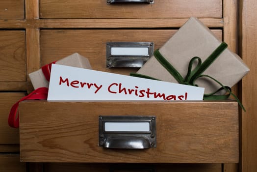 Christmas gifts in the drawer of a cabinet