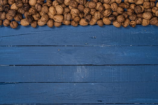 walnuts on a blue wooden table