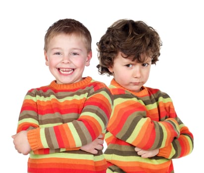 Pair of twins dressed alike with varying degrees of mood