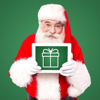 Santa displaying his tablet pc gift for lucky winner