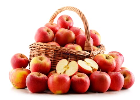 Apples in wicker basket isolated on white background