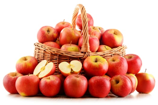 Apples in wicker basket isolated on white background