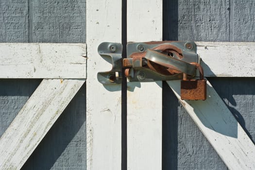Tool Shed Door with Rusty Lock and Handle