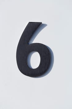Number 6 on a Post Box with white backgound.