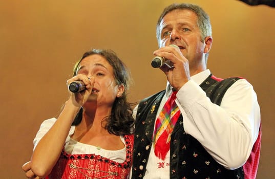 Norbert Rier,frontman of the Kastelruther Spatzen at the 'Spatzen-Fest 2012' in a vocal duet with daughter Marion.