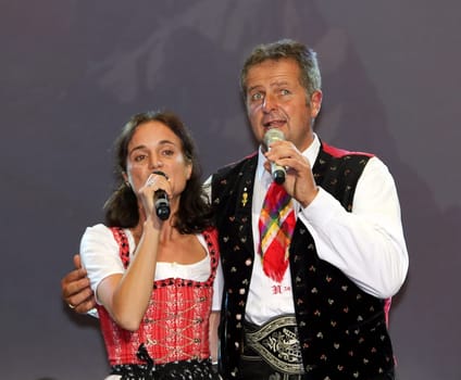 Norbert Rier,frontman of the Kastelruther Spatzen at the 'Spatzen-Fest 2012' in a vocal duet with daughter Marion