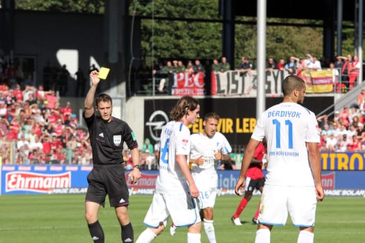 The goal is followed by a frustration foul - Hoffenheim's Rudy receives a yellow card from referee Felix Zwayer