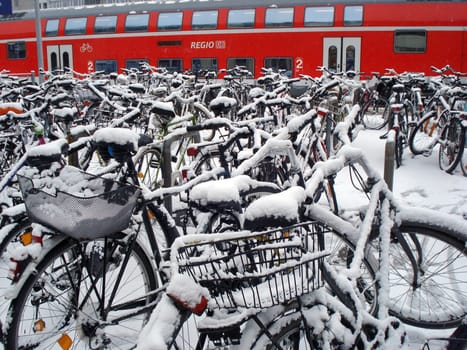 Snowy bicycles at Freiburg Central Station in Breisgau - a rare picture