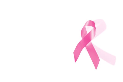 Breast cancer awareness pink ribbon isolated on white background with clipping path to cut and paste on top of a design.