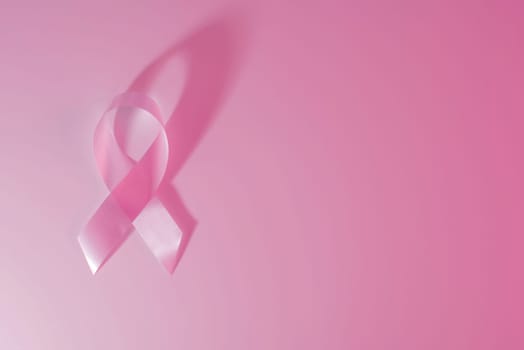 Breast cancer awareness pink ribbon and background with clipping path to cut and paste on a design.