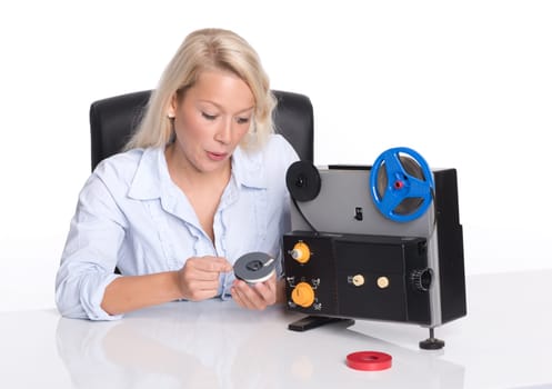 Cutter with film projector holds a film coil