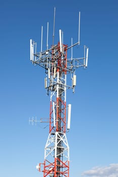 Mobile phone Telecommunication Radio antenna Tower over blue sky
