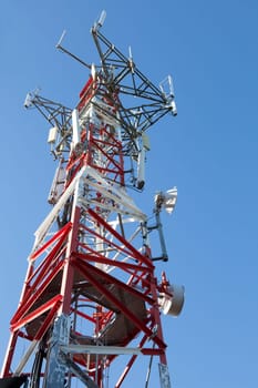 Mobile phone Telecommunication Radio antenna Tower over blue sky