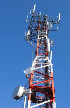 Mobile phone Telecommunication Radio antenna Tower over blue sky