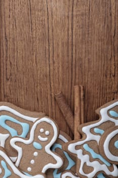 Tray of decorated gingerbread cookies with cinnamon sticks