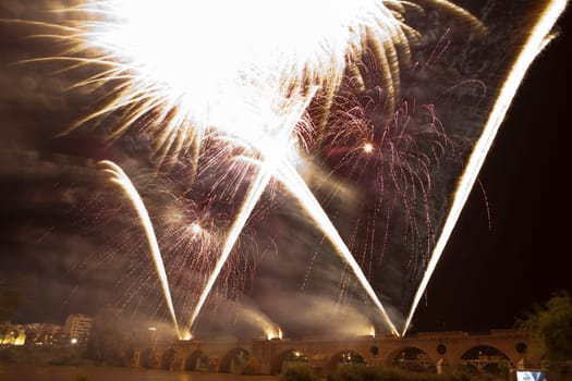 People observing the Puente de Palmas fireworks at San Juan festivity night