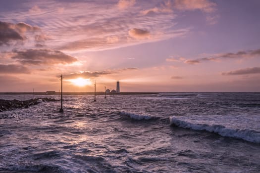 Beautiful sunset on a stormy day at the lighthouse